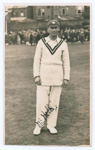 John Berry &lsquo;Jack&rsquo; Hobbs. Surrey & England, 1905-1934. Attractive mono real photograph postcard of Hobbs, full length, in cricket attire wearing M.C.C. touring cap. Very nicely signed in ink by Hobbs. Postally unused. The signature on the postcard was obta