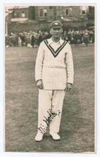 John Berry &lsquo;Jack&rsquo; Hobbs. Surrey & England, 1905-1934. Attractive mono real photograph postcard of Hobbs, full length, in cricket attire wearing M.C.C. touring cap. Very nicely signed in ink by Hobbs. Postally unused. The signature on the postcard was obta