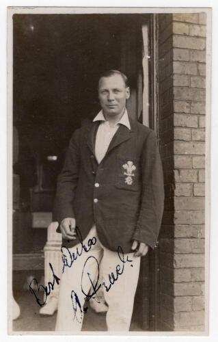 Herbert Alan Peach. Surrey 1919-1931. Original mono real photograph postcard of Peach standing three quarter length in the doorway of a pavilion, wearing cricket attire and Surrey blazer. Signed in black ink to the photograph &lsquo;Best wishes, A. Peach&rsquo;. Appe