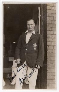 Herbert Alan Peach. Surrey 1919-1931. Original mono real photograph postcard of Peach standing three quarter length in the doorway of a pavilion, wearing cricket attire and Surrey blazer. Signed in black ink to the photograph &lsquo;Best wishes, A. Peach&rsquo;. Appe