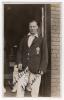 Herbert Alan Peach. Surrey 1919-1931. Original mono real photograph postcard of Peach standing three quarter length in the doorway of a pavilion, wearing cricket attire and Surrey blazer. Signed in black ink to the photograph &lsquo;Best wishes, A. Peach&rsquo;. Appe