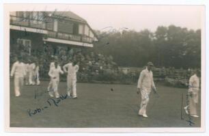 Sussex 1952. Mono real photograph plain back candid style postcard of the Sussex team entering the field of play from the pavilion with spectators looking on, for the match v Lancashire at Blackpool, 6th- 8th August 1952. The photograph signed in ink and 