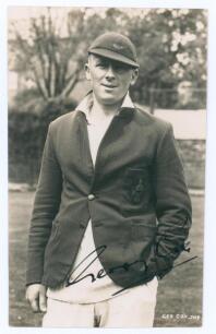 George Cox Junior. Sussex 1931-1961. Mono real photograph postcard of Cox, three quarter length, wearing Sussex cap and blazer. Very nicely signed in black ink &lsquo;George Cox&rsquo;. Printed title &lsquo;Geo Cox Jnr&rsquo;. Deane, Wiles & Millar of Brighton. Postally unused. 