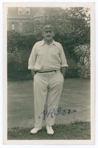 George Rubens Cox (George Cox Senior). Sussex 1895-1928. Sepia real photograph postcard of Cox standing full length wearing cricket attire and Sussex cap, hands in pockets. Very nicely signed in ink to the photograph &lsquo;G.R. Cox. Official stamps to verso fo