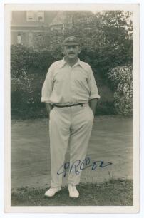 George Rubens Cox (George Cox Senior). Sussex 1895-1928. Sepia real photograph postcard of Cox standing full length wearing cricket attire and Sussex cap, hands in pockets. Very nicely signed in ink to the photograph &lsquo;G.R. Cox. Official stamps to verso fo