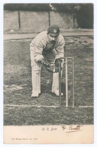 Henry Ridgen &lsquo;Harry&rsquo; Butt. Sussex & England 1890-1912. Early original mono postcard of Butt standing full length in wicket-keeping pose at the wicket, wearing Sussex cap. Signed in black ink to lower margin &lsquo;H. Butt&rsquo;. Wrench Series no. 1385 c.1903. Postal