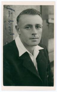 Douglas James &lsquo;Jim&rsquo; Wood. Sussex 1936-1955. Mono real photograph plain back postcard of Wood, head and shoulders wearing cricket attire and blazer. Nicely signed to the top left corner in black ink, &lsquo;Jim Wood&rsquo;. Official stamp to verso for A Wilkes & Son, 