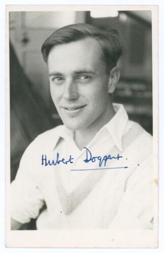 George Hubert Graham Doggart. Cambridge University, Sussex & England 1948-1961. Mono real photograph plain back postcard of Doggart, head and shoulders wearing cricket attire. Very nicely signed in blue ink by Doggart. Official stamp for A. Wilkes & Son, 