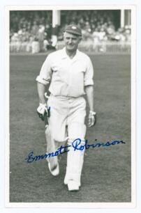 Emmott Robinson. Yorkshire 1919-1931. Original mono real photograph plain back postcard of Robinson walking off the field of play in batting attire, wearing Yorkshire cap. Nicely signed in blue ink to the photograph and to the verso by Robinson. Photograp