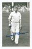 Emmott Robinson. Yorkshire 1919-1931. Original mono real photograph plain back postcard of Robinson walking off the field of play in batting attire, wearing Yorkshire cap. Nicely signed in blue ink to the photograph and to the verso by Robinson. Photograp