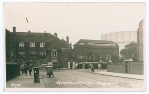 &lsquo;Entrance to The Oval, Kennington&rsquo; c.1910. Early original sepia real photograph postcard of the entrance to the Oval ground with the iconic gas holder in the background. Printed title to lower portion of the image. Published by Gale & Polden Ltd. Postally