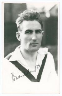 Abraham &lsquo;Abram&rsquo; Waddington. Yorkshire & England 1919-1927. Mono real photograph plain back postcard of Waddington, head and shoulders wearing cricket attire. Signed in ink by Waddington. Official stamp to verso for A. Wilkes & Son, West Bromwich. Very goo