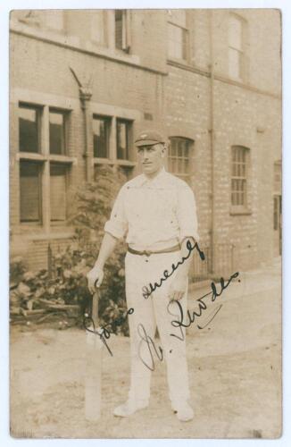 Wilfred Rhodes. Yorkshire, Europeans, Patiala & England 1898-1930. Sepia real photograph postcard of Rhodes standing full length wearing cricket attire, Yorkshire cap, and leaning on a bat. The photograph by A. Robinson of Sheffield, taken at the back of 