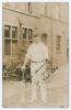 Wilfred Rhodes. Yorkshire, Europeans, Patiala & England 1898-1930. Sepia real photograph postcard of Rhodes standing full length wearing cricket attire, Yorkshire cap, and leaning on a bat. The photograph by A. Robinson of Sheffield, taken at the back of 