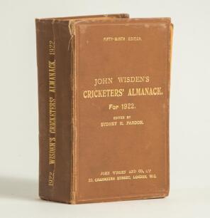 Wisden Cricketers&rsquo; Almanack 1922. 59th edition. Original hardback. Heavy wear to the spine, vertical creasing, wear and a tear to the top of the spine, wear and wrinkling to the board and extremities, ex-library issue, ink annotation to the inside of the 