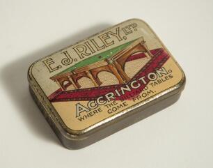 Billiards/ Snooker and hockey. Attractive early 1900s vesta case/ snooker cue tip tin with attractive colour image to the hinged lid of a billiards table and title &lsquo;E.J. Riley Ltd., Accrington. Where the Billiard Tables Come From&rsquo;. 3.25&rdquo;x2.25&rdquo;. Colours ni