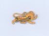 British Lions tour of South Africa 1938. A rare gilt metal pin badge in the form of a gilt lion, the reverse impressed &lsquo;B.R.F.T 1938&rsquo; (British Rugby Football Tour). Complete with original pin fittings and in very good condition. Sold with an official menu - 2