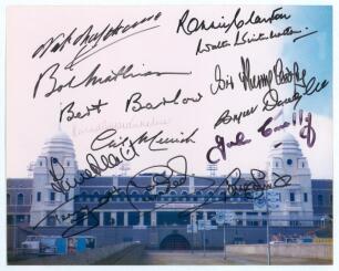 &lsquo;Wembley Greats&rsquo;. Modern colour photograph of the twin towers of the old Wembley stadium. Signed to the photograph in bold black ink by fourteen former footballers and others. Signatures are Nat Lofthouse, Bob Mathias, Bert Barlow, Kenneth Wolstenholme, G