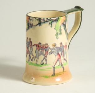 Football tankard. Royal Doulton &lsquo;English Old Football Scenes&rsquo; series tankard with football scenes to side. Stamp to base. 5.5&rdquo; tall. Good condition