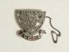 Sussex County Cricket Club pin badge. The silver and marcasite badge with Sussex emblem of the six martlets with &lsquo;S.C.C.C.&rsquo; below. Silver hallmarks for 1975. Complete with safety chain.