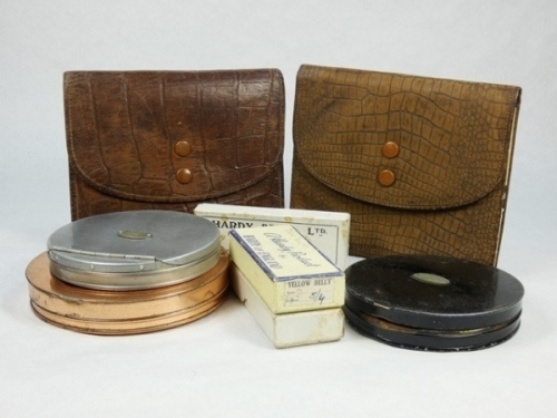 A Hardy Tweed salmon cast case, the faux crocodile leather case fitted three chamois leather cast pouches, twin stud fasteners and gilt stamped makers name, another similar cast case, three Hardy circular, copper, japanned and alloy cast cases, two Hardy 