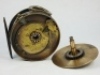 A Hardy Brass Faced 4" salmon fly reel, domed ivorine handle, brass foot, modified brass cage and pillars with fitted heavy brass line guide, strapped rim tension screw with Turk's head locking nut and 1906 calliper spring check mechanism, drum with four - 3