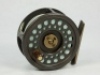 A Hardy Golden Prince 5/6 trout fly reel, brown anodised finish, composition handle, tow screw spring drum latch, nickel silver "U" shaped line guide and rear milled spindle tension adjuster, light use only, in zip case and a Greys "Streamflex" 4 piece c