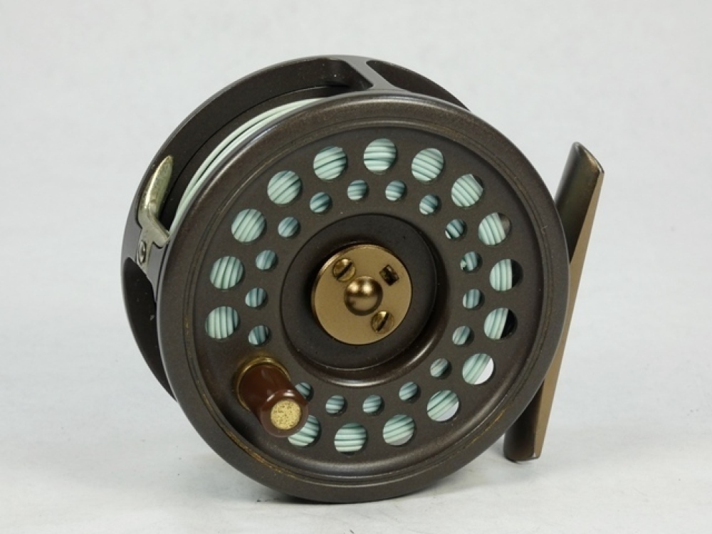 A Hardy Golden Prince 5/6 trout fly reel, brown anodised finish,  composition handle, tow screw spring drum latch, nickel silver U shaped  line guide and rear milled spindle tension adjuster, light use