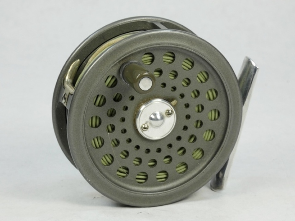 A Hardy JLH Ultralite #5 trout fly reel, grey anodised finish, composition  handle, alloy foot, two