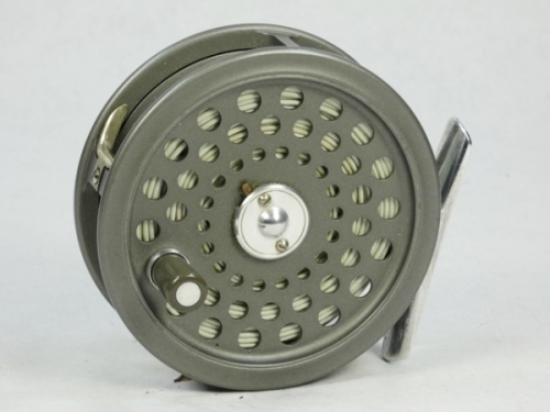 A Hardy JLH Ultralite #6 trout fly reel, grey anodised finish, composition handle, alloy foot, two screw spring latch and rear spindle mounted tension adjuster, little used condition, in modern Selvyt bag and a Hardy "Ultralite" 2 piece carbon trout fly r