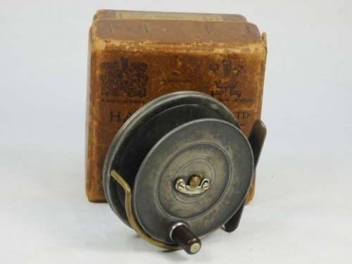 A Hardy Sunbeam 3 ¼" trout drum fly reel, exposed drum with ebonite handle and nickel silver locking latch, brass stancheon foot, brass Bickerdyke line guide and fixed Mk.I check, light wear to finish from normal use, in Hardy brown card trade box, 1920's