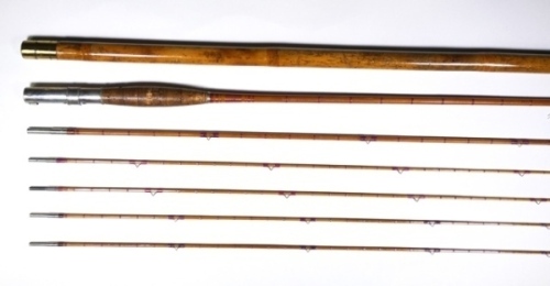 A Leonard & Mills "H.L. Leonard" 3 piece (4 tips) cane trout fly rod, 10', scarlet silk inter-whipped, sliding nickel silver reel fitting, swollen butt section, nickel silver spigot joints, in bag and with brass capped bamboo tip tube