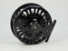 A good Abel Super 7/8N trout/salt-water fly reel, left hand wind model with black anodised finish, counter-balanced rosewood handle, multi-perforated shallow cored drum and backplate, rear spindle mounted tension adjuster, as new condition, in card box an - 2