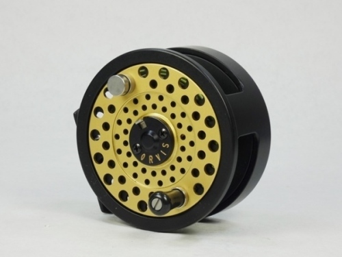 An Orvis DXR Multiplier 9/10 salmon/salt-water fly reel, left hand wind model with black/gold anodised finish, counter-balanced handle, rear eleven point tension adjuster, only very light use, in original zip case