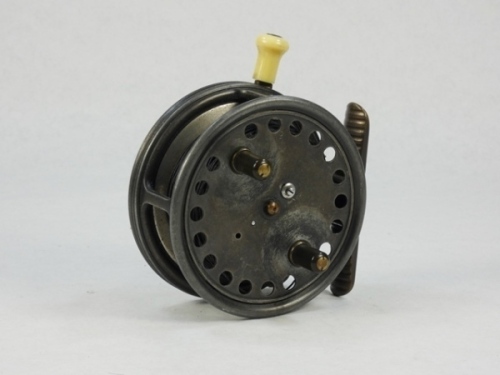 A Hardy Silex Major 3 ½" bait casting reel, shallow cored drum with twin ebonite handles, jewelled spindle bearing and spring release latch, ribbed brass foot, rim mounted ivorine casting trigger, milled nickel silver tension screw and rear mounted ivorin