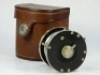 A scarce Otto Zwarg Saguenay 1/0 direct drive light salmon fly reel and block leather case, ebonite and nickel silver construction, tapered ebonite handle on serpentine crank winding arm set within an anti-foul rim, pieced alloy foot stamped model details - 2