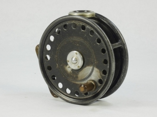 A Hardy St George 3 ¾" trout fly reel, ebonite handle, ribbed brass foot, white agate line guide (no cracks), rim mounted rim tension screw and Mk.II check mechanism, light wear to lead finish from normal use, 1930's
