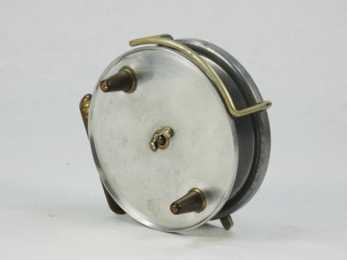 A scarce Hardy Wallis No.2 pattern 3 ½" centre pin reel, shallow cored solid alloy drum with twin reverse tapered ebonite handles and nickel silver telephone drum latch, ribbed brass foot, rim mounted nickel silver optional check lever and bar spring che