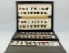 A good Allcock salesman's folio of High Grade Trout flies, the rectangular rexine case opening to reveal five panels of ninety six various trout patterns to gut casts displayed on red printed trade cards, cover with gilt stamped Stag logo and makers deta - 2