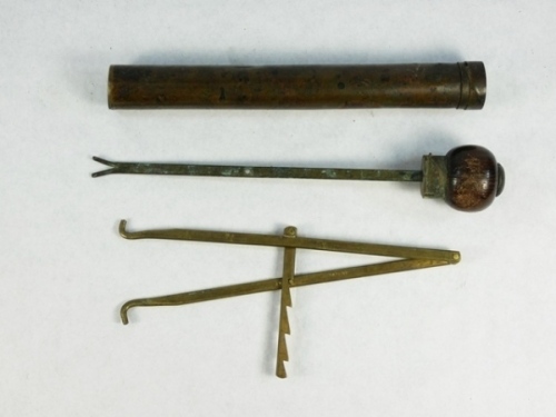 A rare Warner's of Redditch Bickerdyke pike fisher's combination priest the brass cylindrical priest with fruitwood knopped stud locking cap fitted with "V" disgorger and containing a further calliper scissor gag stamped with 12" ruler to one side, drop b