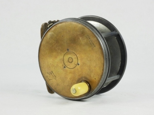 A Hardy Brass Faced Perfect 4 ½" salmon fly reel, domed ivorine handle, brass foot, strapped rim tension screw with Turk's head locking nut and 1906 calliper spring check mechanism, drum with four rim cusps and milled nickel silver locking screw, facepla