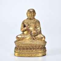 A Gilt-bronze Seated Guru