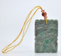 A Carved Jadeite Plaque