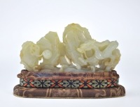A Carved White Jade Dragon with Rock