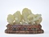 A Carved White Jade Dragon with Rock