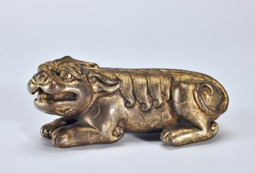 A Gilt-bronze Beast