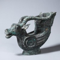 A Bronze Ram Head Rhyton Cup