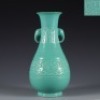 A Green Glazed Moulded Vase