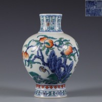 A Doucai Glazed Peaches and Bats Vase