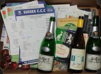 Cricket ephemera 1940s-2000s. Box comprising a selection of scorecards, pin badges, 'Merry Christmas' miniature bats (one signed by Geoff Boycott) and balls, two empty champagne and one white wine bottle, each signed to the label by Boycott, tour brochure